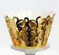 Golden laser-cut cupcake wrapper featuring intricate butterfly and vine hollow patterns - Reflective Gold