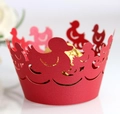 Close-up of laser-cut dark purple cupcake wrappers featuring elegant duck pattern - Pearlescent Red