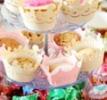 Macro view of laser-cut crown lace cupcake wrappers for wedding cake decoration - Jewelry Cream Star
