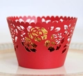 Detail of red laser-cut cupcake wrapper with rose pattern for elegant dessert decoration - Pearlescent Red