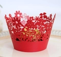 Macro detail of red laser-cut floral paper cupcake wrappers for festive decorations - Pearlescent Red