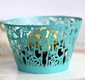 Close-up of laser-cut skull and spider web cake wrapper in sky blue cardstock - Tiffany Blue