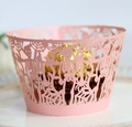 Detailed laser-cut pink cupcake wrapper with skull and dead tree Halloween patterns - Pink