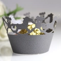 Detail of laser-cut cupcake wrapper with bear and horse patterns on a chocolate sphere - Silver Charcoal