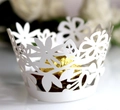 Detail of white laser-cut floral cupcake wrapper with elegant pearl finish texture - 5cm / White