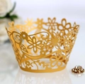 Intricate laser-cut gold floral cupcake wrapper with elegant vine hollow patterns - Gold