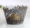 Detail of dark grey laser-cut flower cupcake wrapper with intricate hollow patterns - Silver Charcoal