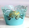 Close-up of laser-cut cupcake wrapper in light blue with intricate scroll lace patterns - 5cm / Tiffany Blue
