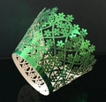 Detailed laser-cut floral cupcake wrapper in glossy metallic green for party decoration - Reflective Green