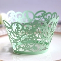 Elegant mint green laser-cut floral cupcake wrapper with intricate hollowed patterns - Fruit Green