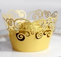 Detail of gold laser-cut hollow lace cupcake wrapper for wedding dessert decor - Gold