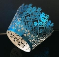 Detailed laser-cut heart and floral patterns on metallic blue cupcake paper wrappers - Reflective Blue