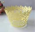 Detail showing laser-cut floral and heart lace cupcake wrapper in pale yellow finish - Lemon Yellow