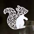 Intricate laser-cut white squirrel place card with floral patterns for wedding wine glasses - White