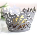 Macro shot of laser cut silver leaf cupcake liner wrapped around golden truffle - Silver Charcoal