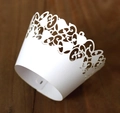 Laser-cut white cupcake wrappers with intricate Christmas bell and leaf scroll patterns - 5cm / White
