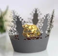 Macro detail of laser-cut snowflake tree paper cupcake wrapper for holiday dessert decor - Silver Charcoal