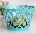 Detail of laser-cut lake blue cupcake wrappers with elegant star and geometric patterns - 5cm / Tiffany Blue