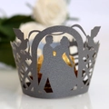 Close-up of laser-cut wedding cupcake wrappers with romantic bride and groom silhouette - Silver Charcoal