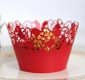 Close-up of red laser-cut lace cupcake wrapper with intricate vine pattern and chocolate - 5cm / Pearlescent Red