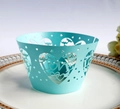 Detail of light blue laser-cut cupcake wrapper with love hearts and lettering for weddings - Tiffany Blue