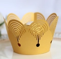 Close-up of laser-cut gold crown cupcake wrapper and decorative chocolate liner - Gold