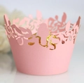 Macro shot of pink laser-cut cupcake wrapper with bird and floral hollow patterns - 5cm / Pink