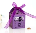 Close-up of a purple hollow candy box with laser-cut floral fence and silk ribbon bow - Dark Purple