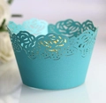 Close-up of laser-cut rose hollow cupcake wrappers in elegant tiffany blue pearlescent paper - Tiffany Blue