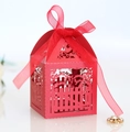 Detail of red hollowed-out candy box with laser-cut patterns and ribbon bow - Pearlescent Red