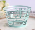 Macro view of laser-cut musical note patterns on mint blue cupcake paper wrappers - Light Blue Zircon