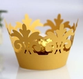Macro detail of laser-cut hollow golden crown cupcake wrapper with intricate floral patterns - 5x5x8CM / Gold Yellow