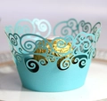 Light blue laser-cut cupcake wrappers featuring elegant filigree swirl vine patterns - Tiffany Blue