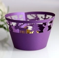 Detail of purple laser-cut Christmas cupcake wrapper with snowman and reindeer patterns - Dark Purple