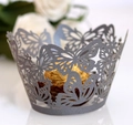 Silver laser-cut cupcake wrapper with butterfly pattern holding a gold foil chocolate - 5cm / Silver Charcoal