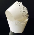 Laser-cut white rose pattern paper cupcake liners showing intricate floral details - White