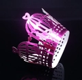 Detailed laser cut pink birdcage cupcake wrapper with heart motif on black background - Reflective Rose Red