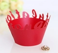 Close-up of red laser-cut cupcake wrappers with Congratulations hollow lettering - Pearlescent Red