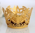 Close-up of golden laser-cut butterfly cupcake wrapper with intricate floral patterns - 5*5*8CM / Gold