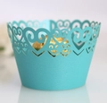 Detail of Tiffany blue cupcake wrapper featuring laser-cut heart pattern and glitter texture - Tiffany Blue