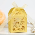 Detailed laser-cut hollow pattern and yellow ribbon bow on wedding candy gift box - Gold