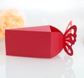 Close-up of laser-cut red butterfly candy box with sharp geometric folds for wedding - Pearlescent Red