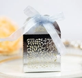 Close-up of laser-cut hollow floral candy box with light blue satin ribbon bow - Reflective Silver