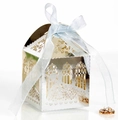 Macro shot of laser-cut silver wedding favor box with blue satin bow and intricate floral patterns - Reflective Silver