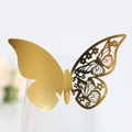 Detailed view of a gold 3D butterfly place card with laser-cut wing on a glass rim - Reflective Gold