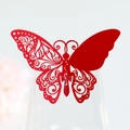 Macro view of laser-cut red butterfly wine glass card with intricate hollow vine details - Pearlescent Red