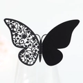 Close-up of laser-cut butterfly place card with intricate floral hollow wing detail - Black Khaki