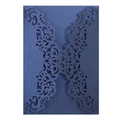 Close-up of navy blue laser-cut invitation sleeve with intricate floral scrollwork - Magic Blue