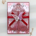 Detailed view of laser-cut wedding invitation with red ribbon and 3D butterfly ornament - Dark Red