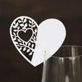 White heart-shaped laser-cut wine glass place card with hollow vine leaf patterns - White